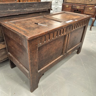 Lot 106 - An 18th century oak panel front and top coffer...