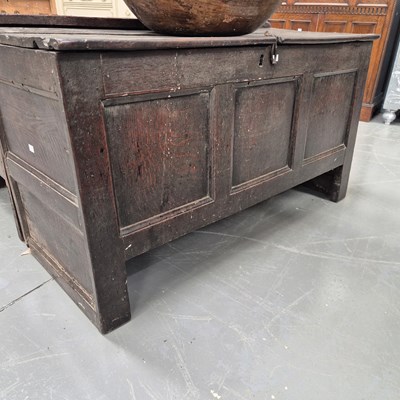 Lot 111 - A Georgian oak coffer with three panel front...