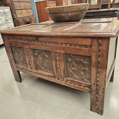 Lot 112 - An early 18th century oak coffer with panel...