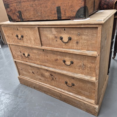 Lot 114 - A late 19th century pine chest of four drawers...