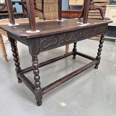 Lot 117 - An 18th century oak side table with peripheral...