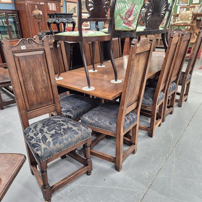 Lot 133 - A set of ten oak panel back dining chairs