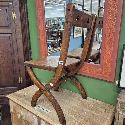 Lot 147 - A Victorian oak x-frame hall chair