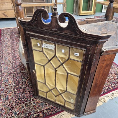Lot 162 - A glazed corner cabinet H 109 W 69 D 47cm