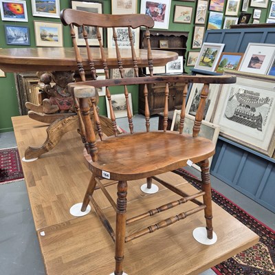 Lot 164 - An antique spindle back armchair