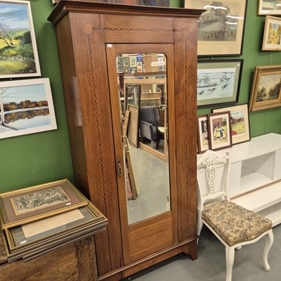 Lot 194 - An Edwardian mahogany wardrobe with mirror...