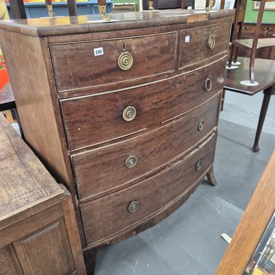 Lot 200 - An early 19th century mahogany bow-front chest...