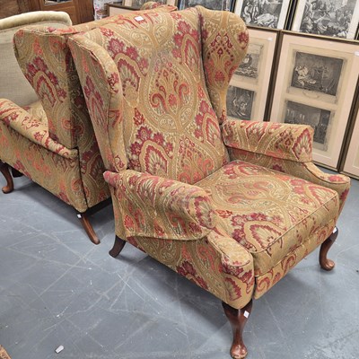 Lot 202 - A pair of reclinging wingback armchairs