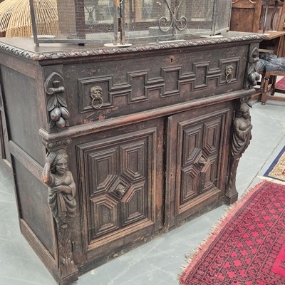 Lot 204 - A 19th century carved oak side cabinet with...