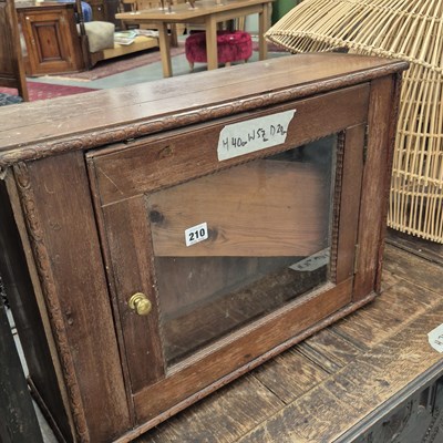 Lot 210 - A small glazed door cabinet H 40 W 57 D 29cm