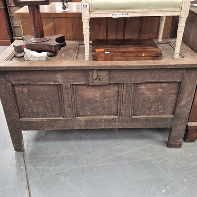 Lot 220 - An 18th century oak coffer with a panel top...