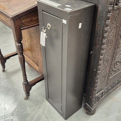 Lot 239 - A small steel gun cabinet H 81 W 26 D 18