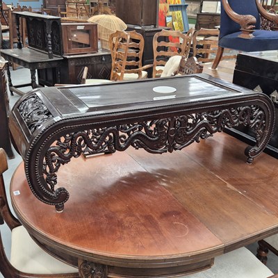 Lot 252 - A low oriental carved hardwood coffee table H...