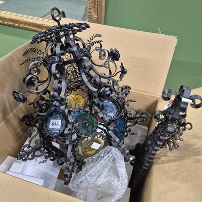 Lot 415 - An Italian wrought iron and coloured bullseye...