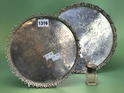 Lot 1316 - A graded pair of white metal circular trays...