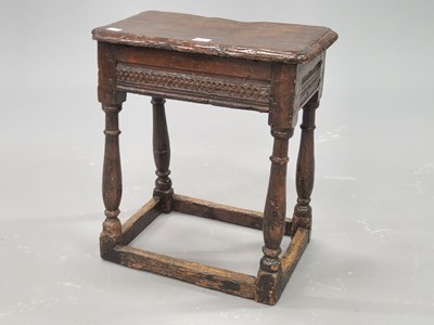 Lot 1362 - A late 17th century oak joint stool, the chip...