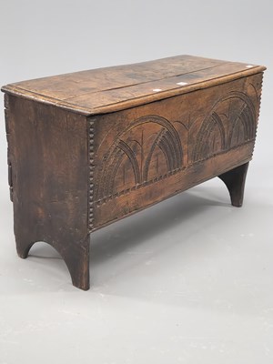 Lot 1366 - An 18th century oak coffer, the front panel...