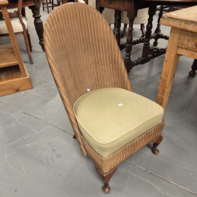 Lot 261 - A Lloyd Loom nursing chair