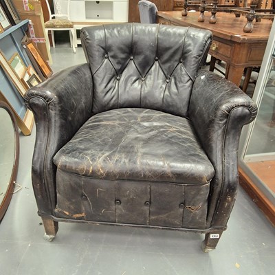 Lot 284 - A vintage button leather club armchair