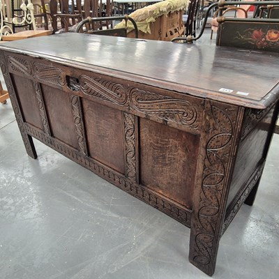 Lot 313 - An 18th century oak panel front coffer with...