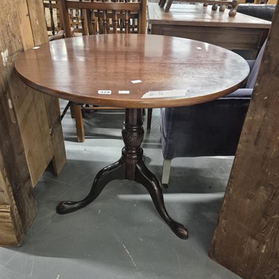 Lot 329 - A 19th century mahogany tripod table.
