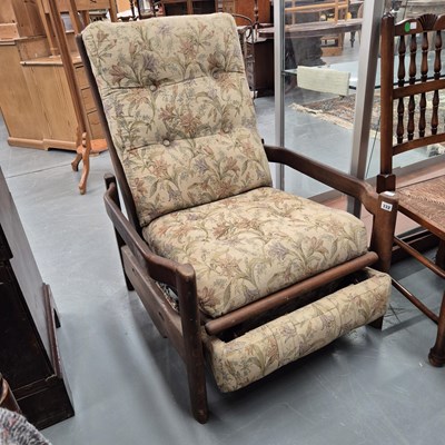 Lot 332 - A retro 1980s teak framed reclining armchair