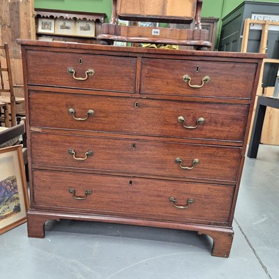 Lot 345 - A late Georgian mahogany chest of two short...