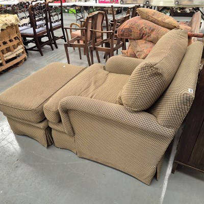 Lot 365 - An American armchair and stool in the Howard...