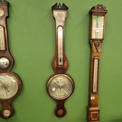 Lot 384 - A Regency mahogany five-glass banjo barometer...
