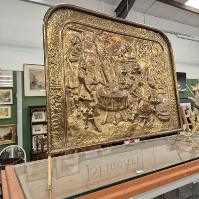 Lot 390 - A large brass firescreen