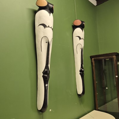 Lot 419 - A pair of very large stylised African mask...