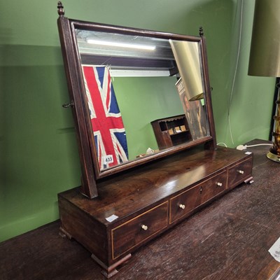 Lot 433 - A Georgian mahogany swing mirror with a...