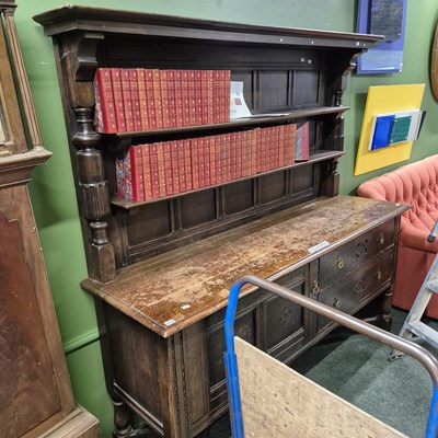 Lot 438 - An early 20th century oak dresser with plate...