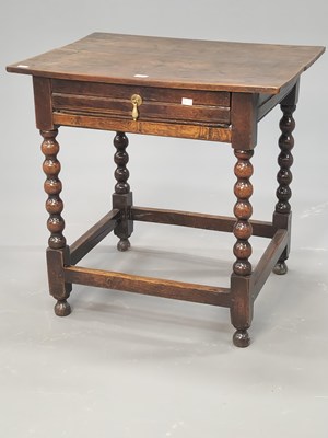 Lot 1369 - An 18th century oak table with a single drawer...