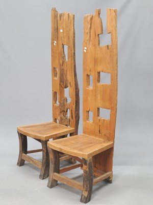 Lot 1374 - A pair of unusual chairs, the tall backs...