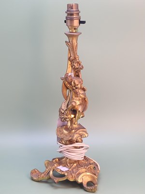 Lot 1377 - A rococo ormolu table lamp, the foliate column...