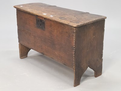 Lot 1380 - A 17th century oak coffer, the plank sides and...
