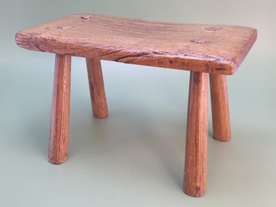 Lot 1383 - An 18th century oak milking stool, the...