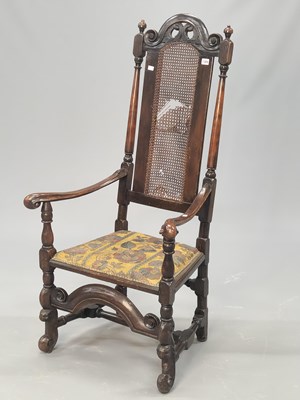 Lot 1384 - A late Stuart style walnut armchair, the tall...