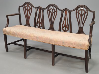 Lot 1387 - A Chippendale style mahogany triple chair back...