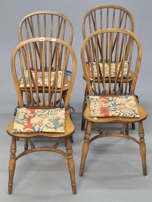 Lot 1392 - A set of four hoop stick backed chairs, the...