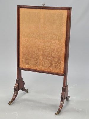 Lot 1393 - A mahogany and damask fire screen with a...