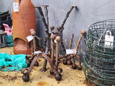 Lot 448 - A wrought iron table base, together with four...