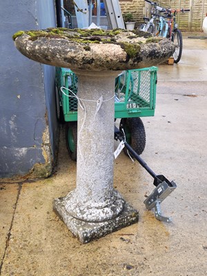 Lot 450 - A stone cast bird bath with plinth