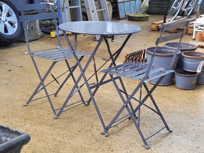 Lot 464 - A round aluminium folding table with two chairs