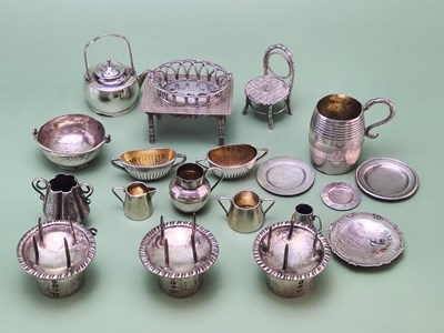 Lot 1409 - A collection of miniature silver and white...