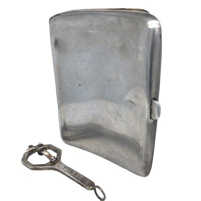 Lot 1159 - A hallmarked silver spanner pendant, engraved...