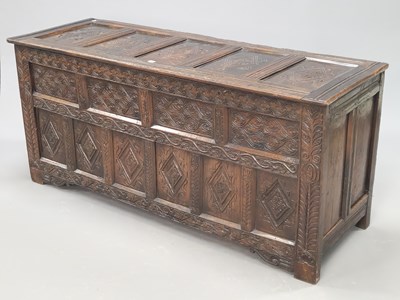 Lot 1416 - An 18th century oak coffer with five diamond...