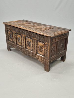Lot 1417 - An 18th century oak coffer with four diamond...