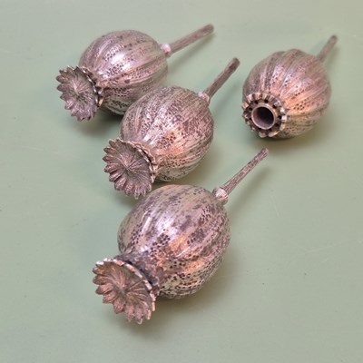 Lot 1418 - Four antique hallmarked silver poppy...